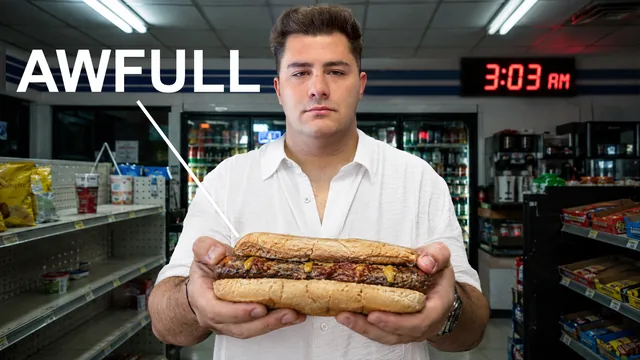 Man holding a giant sandwich in a store at 3:03 AM